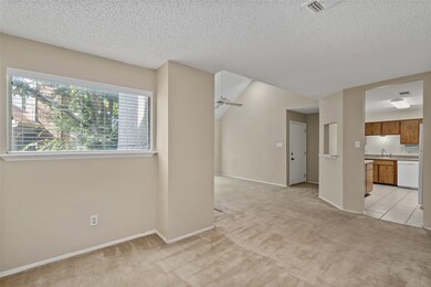 The dining room also features a large window, allo