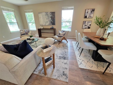 Living area featuring baseboards and wood finishe