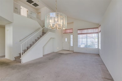 Foyer entrance featuring carpet floors, a high cei