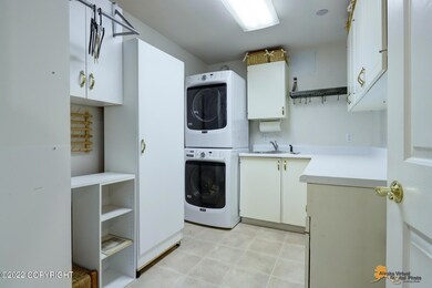 Large laundry w/cupboars & utility sink