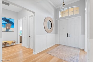 Entrance foyer featuring decorative wall panels &