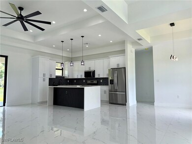 Kitchen with stainless steel appliances, a center