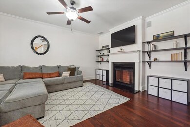 Living room with dark hardwood / wood-style floori