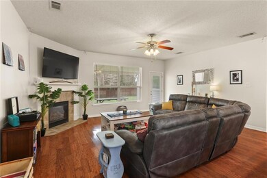 Large living room with gas fireplace and unobstruc