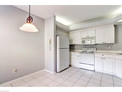 White on white cabinets, appliances, counters and 