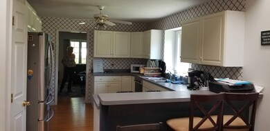 Eat in Kitchen. White Bright and up to date.