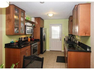 Kitchen. Remodeled kitchen! Gas stove 2 months old! The tile floors are porcelain tile not just ceramic. Black granite tiled countertops.