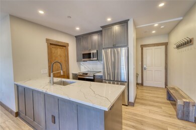 Kitchen featuring tasteful backsplash, lvp floorin