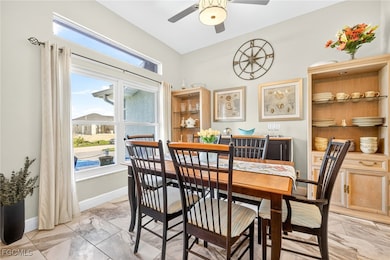 Dining area featuring light marble finish flooring