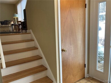 Beautiful hardwood stairs lead you to the living r