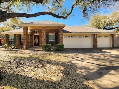 View of front of home featuring brick siding, an 