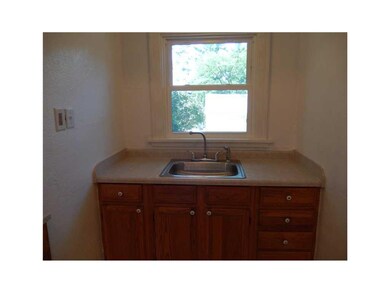 Kitchen. Window above sink overlooks back yard.