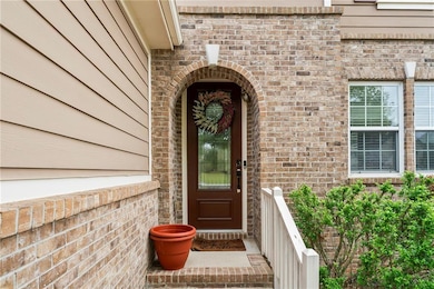 Doorway to property with brick siding