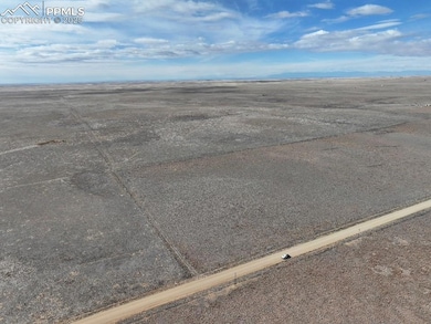 Birds eye view of property featuring a rural view