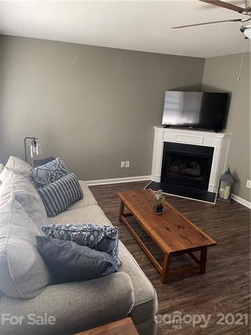Fresh paint, wood laminate flooring, gas fireplace and ceiling fan all included in the great room!