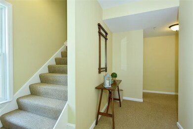 Wide stairway up to unit.