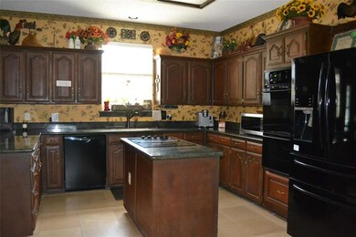 Kitchen with cooktop center island