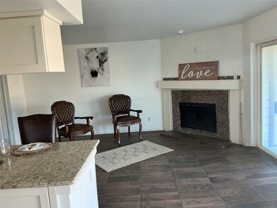 Living room with a high end fireplace and baseboards