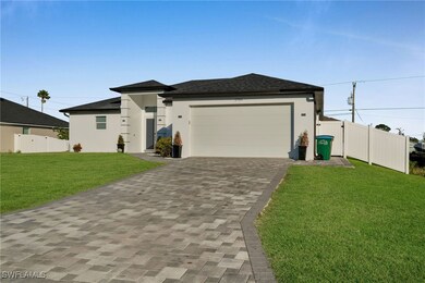 View of front of home featuring a garage and a fro