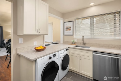 Full size washer and dryer! Convenient pass-through to dining room.