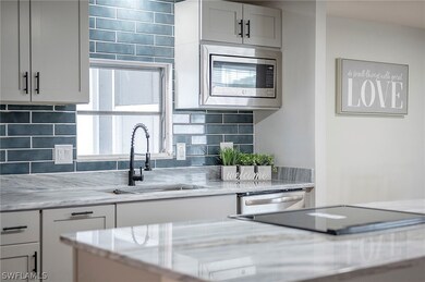 Kitchen with appliances with stainless steel finis