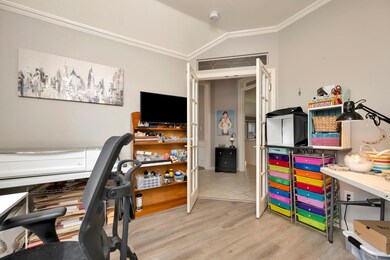 Office area featuring vaulted ceiling, wood finish
