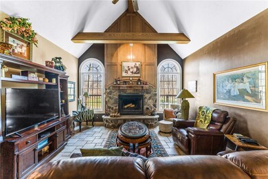 Sunken great room w/ stone front fireplace, vaulte
