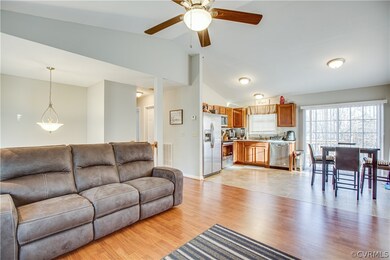 Living room open to kitchen/dining room combination.