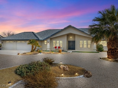 View of front of home featuring french doors, driv
