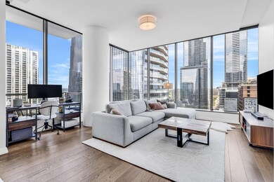 Living room with floor to ceiling windows and har