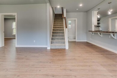 Unfurnished living room with hardwood / wood-style