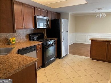 Recently renovated kitchen with plenty of cabinet space and pantry.