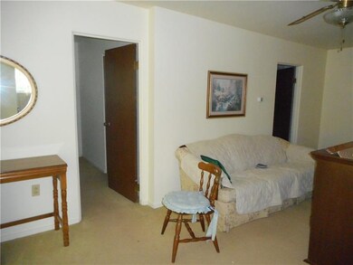 Living room has sliders to back patio.