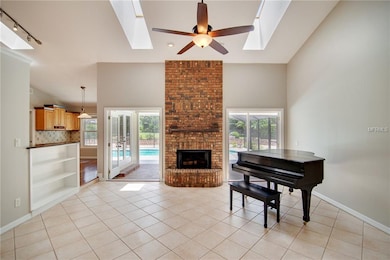 Living room with a cozy wood burning fireplace & s