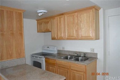 Cozy and functional kitchen with wood cabinets and