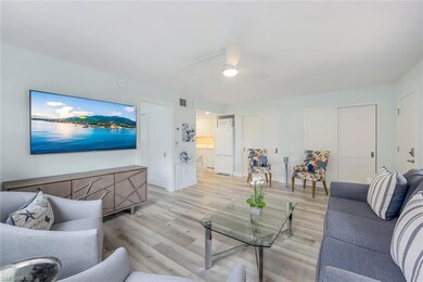 Living room with light flooring, ceiling fan