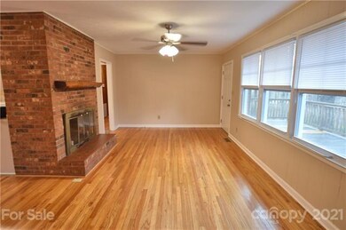 Living Room w/ Brick Fireplace