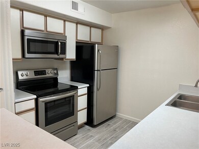 Kitchen featuring appliances with stainless steel