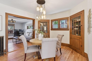 Dining room with beautiful original corner cabinets.