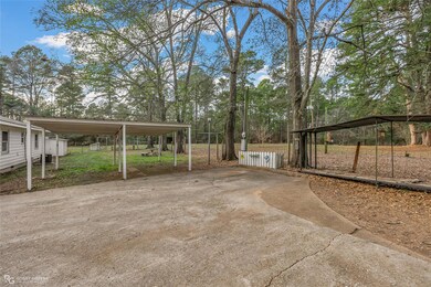 View of yard with a carport