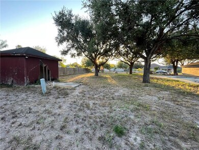 View of yard featuring a storage unit