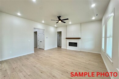 The centerpiece of the room is a beautiful electric fireplace, adding a touch of charm.
