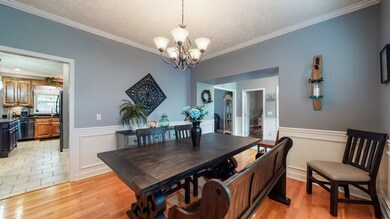 Formal dining room off the entrance that leads to the kitchen