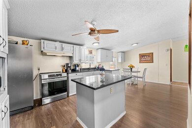 Kitchen with a ceiling fan, appliances with stainl
