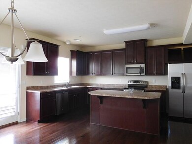 island kitchen with stainless appliances,hardwood 
