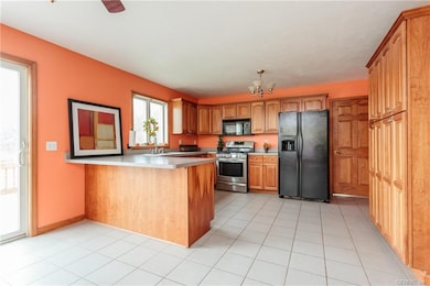 Gorgeous cherry kitchen with ceramic tile flooring