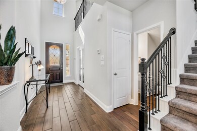 Step inside and appreciate a few of the wonderful features this home offers like the 8' mahogany wood & glass front door, wood-look tile flooring,and fantastic natural light.
