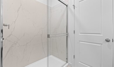 Primary bath with glass shower enclosure