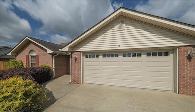 Single story home featuring driveway, a garage, an