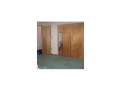 To the right of these double closets in the Master